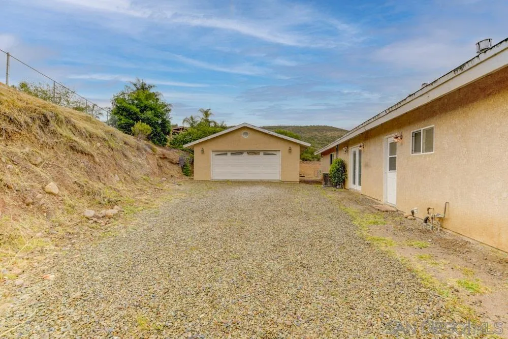 11949 Rocoso Road Lakeside, CA 92040 - Photo 27 of 27 a view of a house with a yard