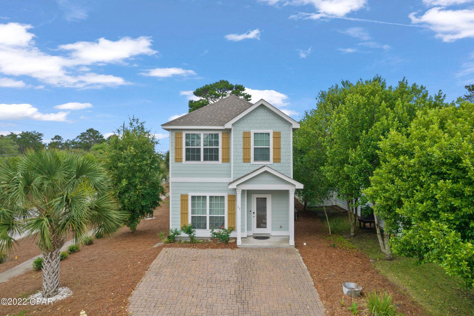 11 Topside Drive Inlet Beach, FL 32461 - Photo 1 of 31 a front view of a house with a garden