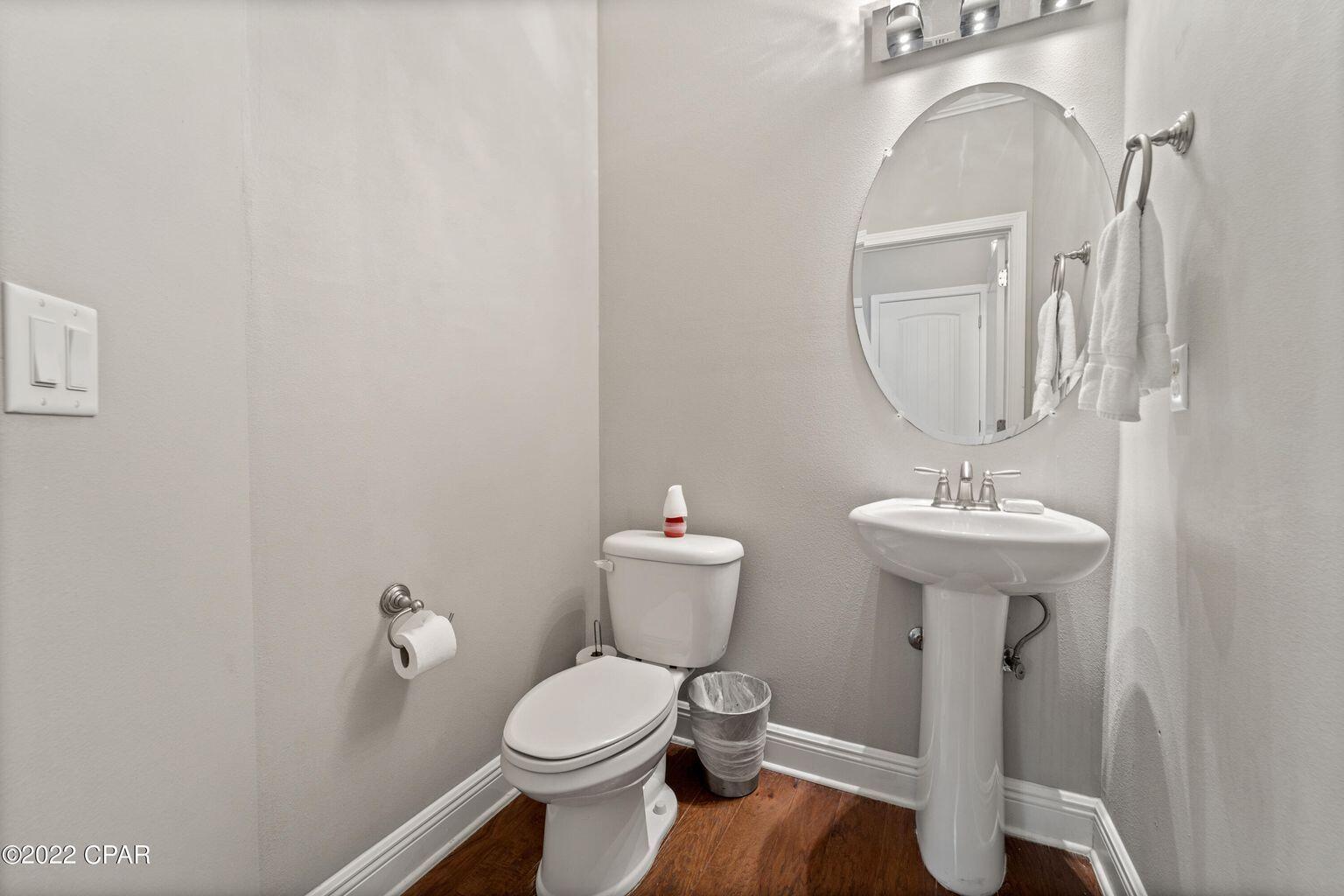 11 Topside Drive Inlet Beach, FL 32461 - Photo 18 of 31 a bathroom with a toilet sink and mirror