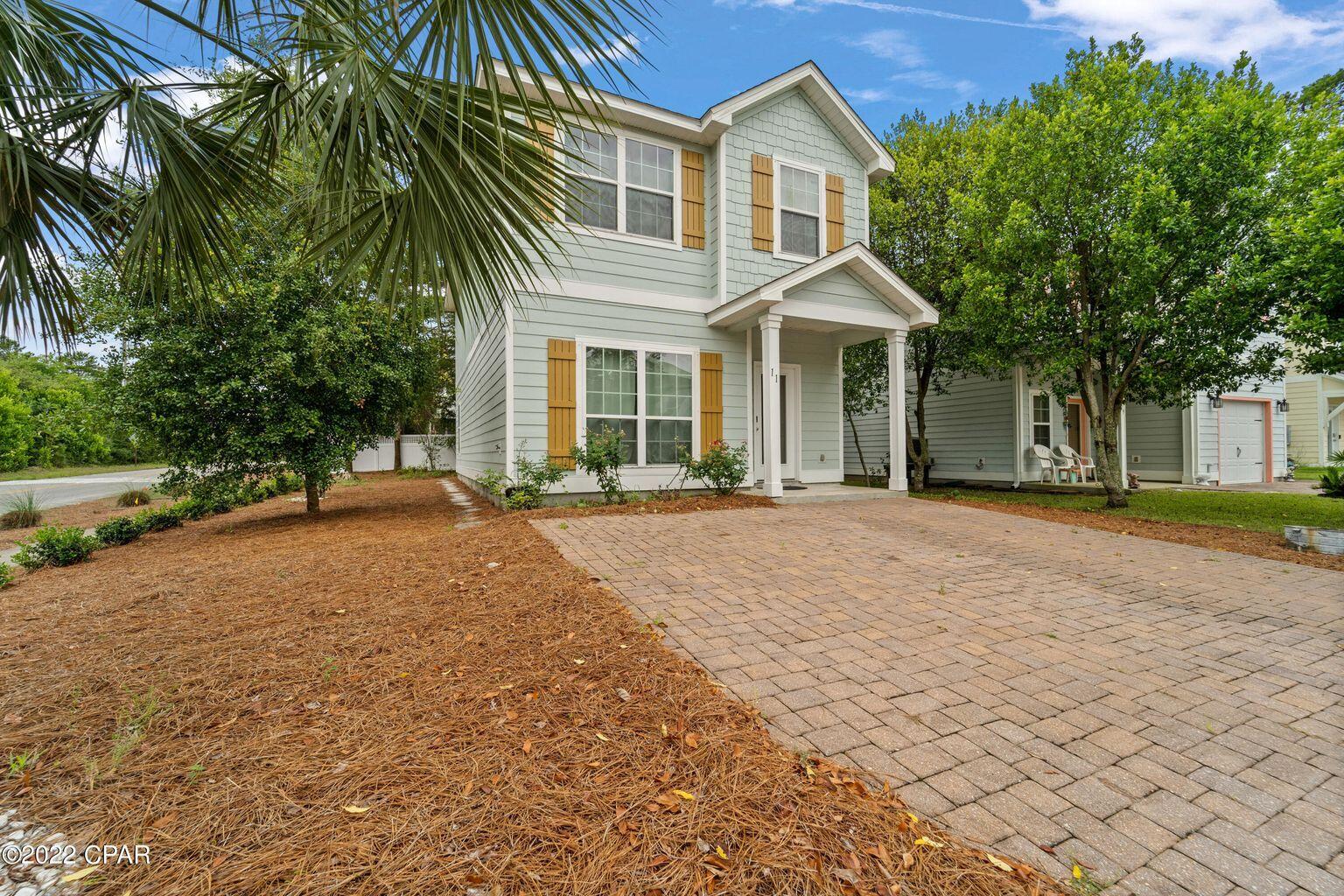 11 Topside Drive Inlet Beach, FL 32461 - Photo 2 of 31 a front view of a house with a yard and trees