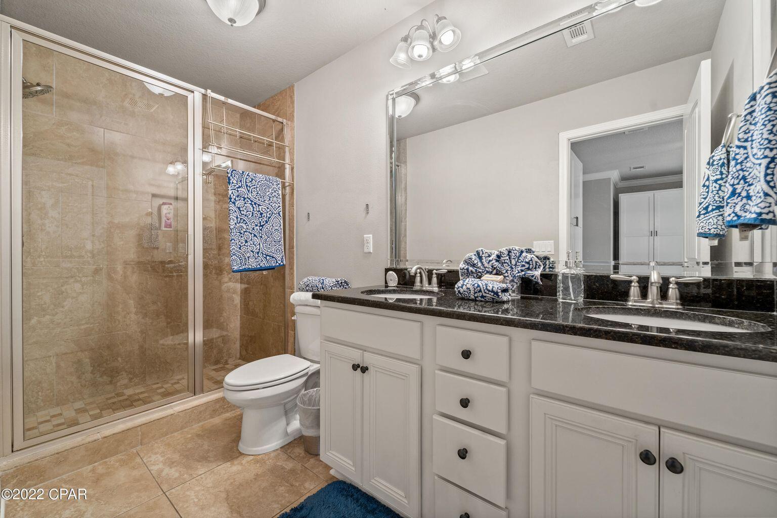 11 Topside Drive Inlet Beach, FL 32461 - Photo 23 of 31 a bathroom with a double vanity sink mirror and toilet