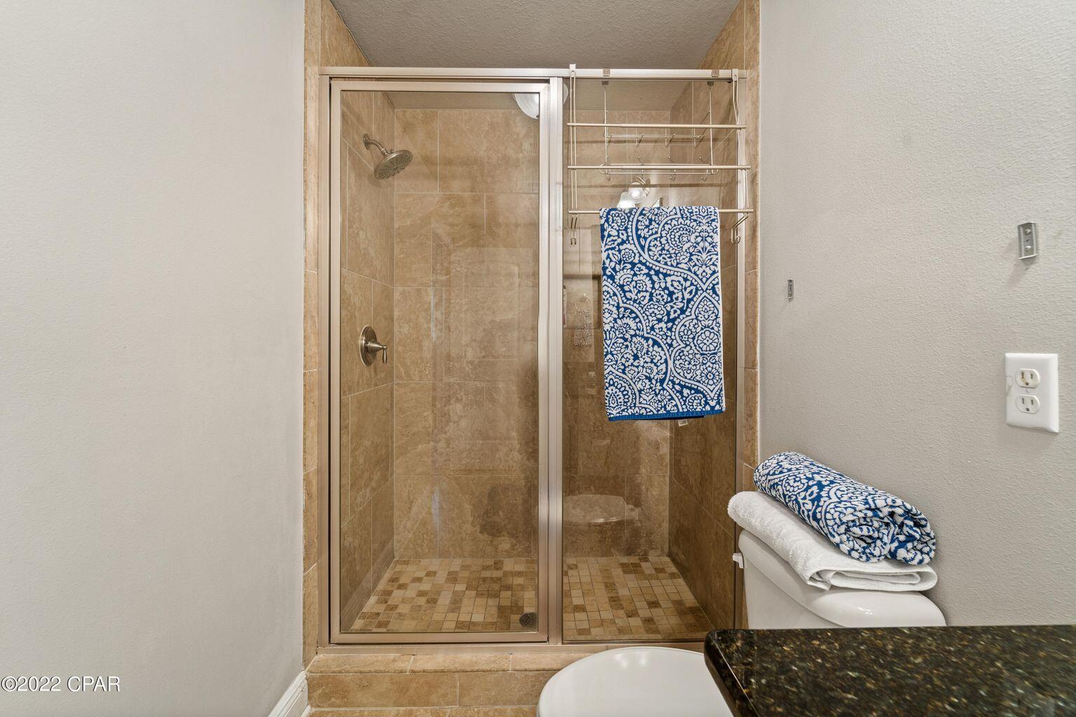 11 Topside Drive Inlet Beach, FL 32461 - Photo 3 of 31 a bathroom with a shower a toilet and a window