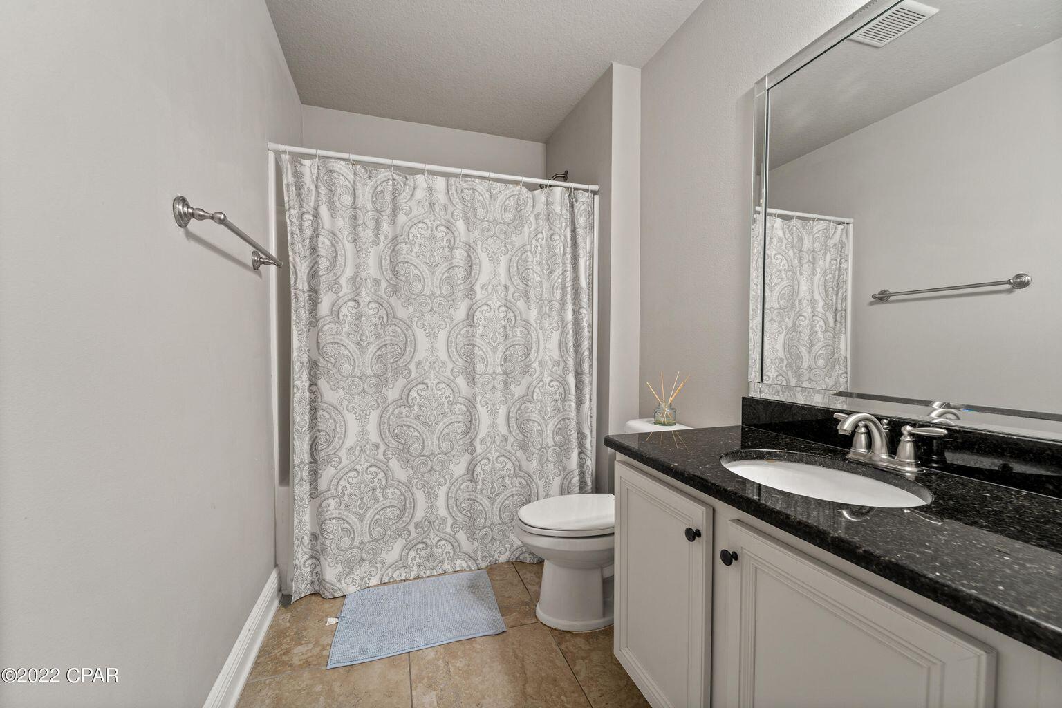 11 Topside Drive Inlet Beach, FL 32461 - Photo 6 of 31 a bathroom with a granite countertop sink toilet and shower