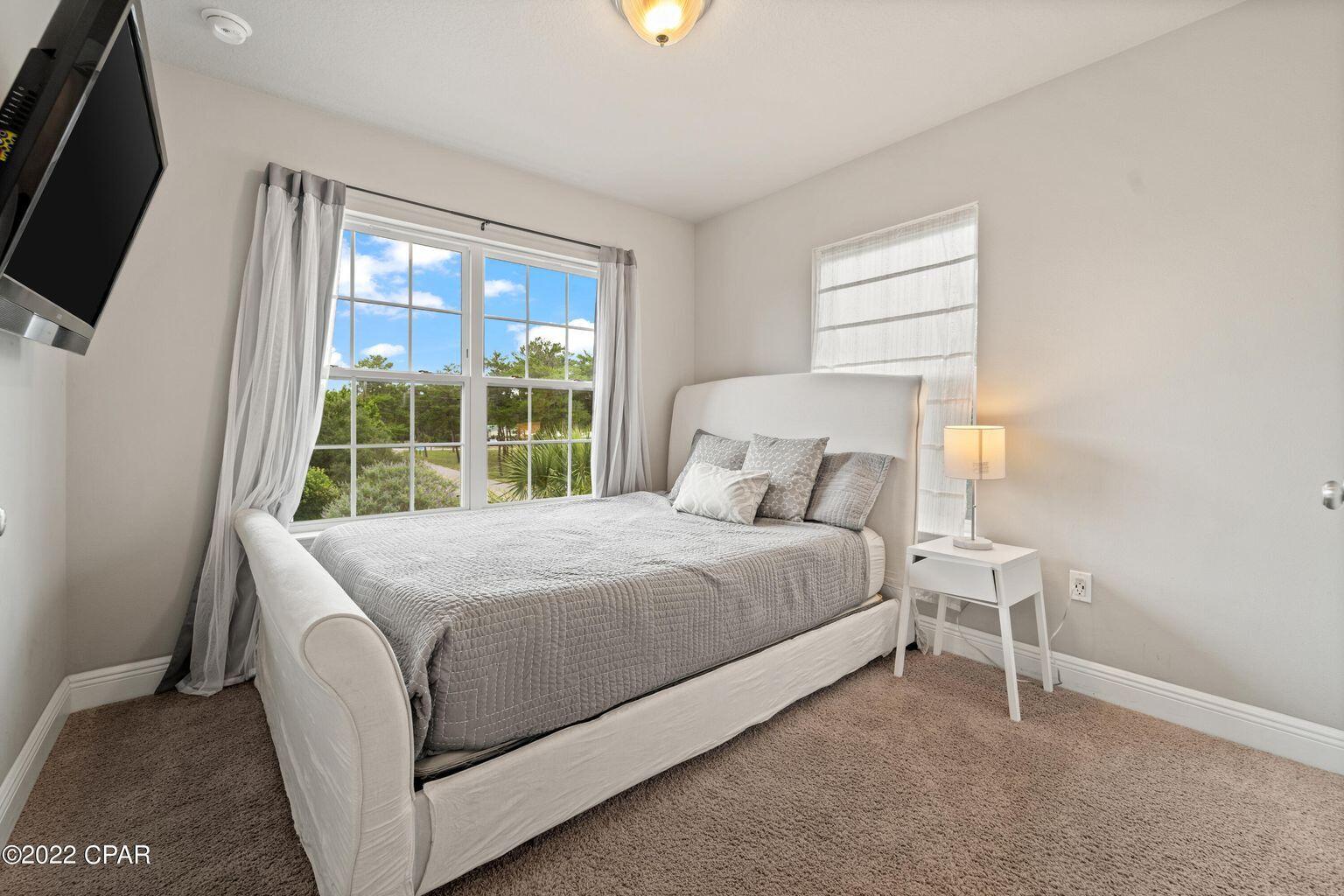11 Topside Drive Inlet Beach, FL 32461 - Photo 8 of 31 a bed sitting in a bedroom next to a window