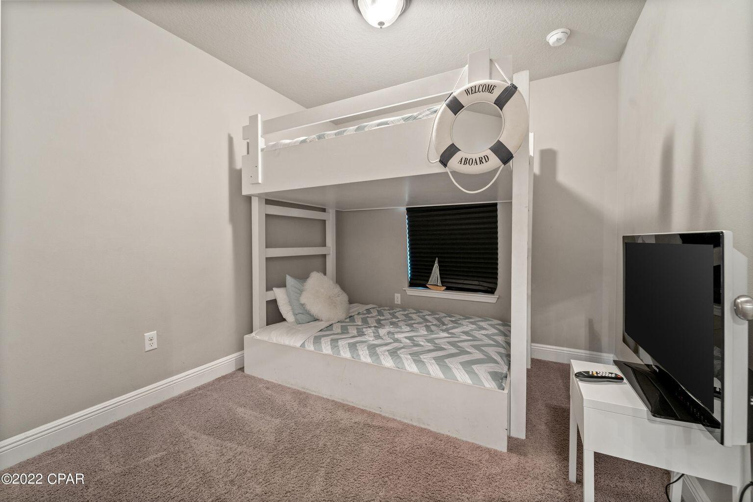 11 Topside Drive Inlet Beach, FL 32461 - Photo 9 of 31 a bedroom with a bed and a flat screen tv