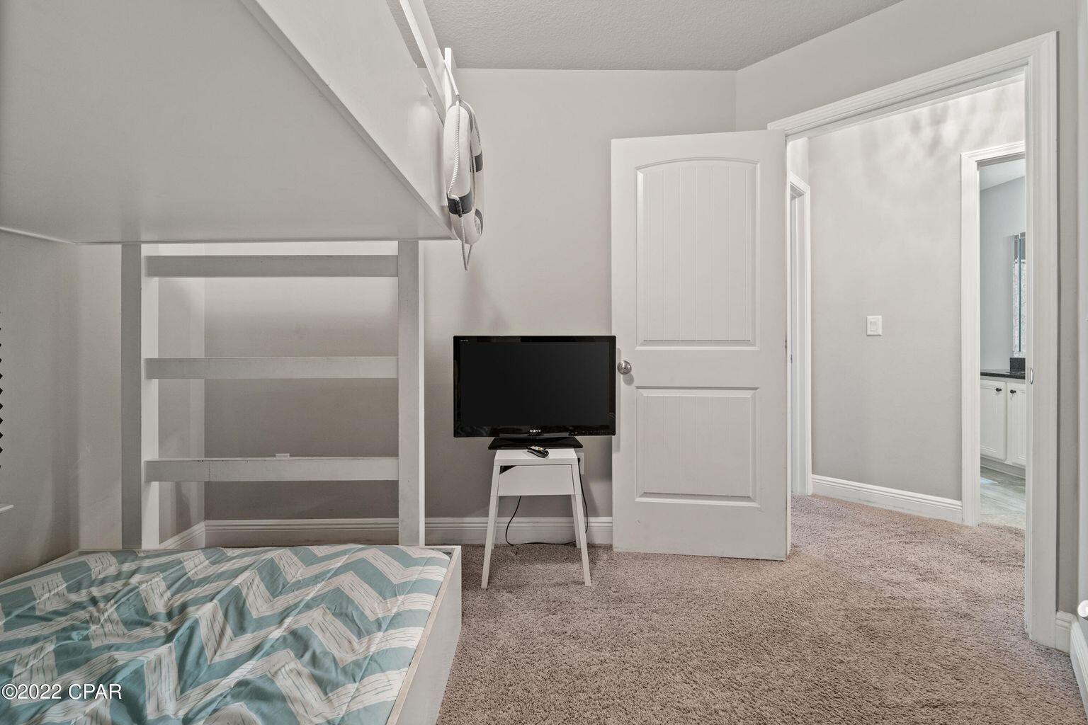 11 Topside Drive Inlet Beach, FL 32461 - Photo 10 of 31 a bedroom with a bed and a chair in it