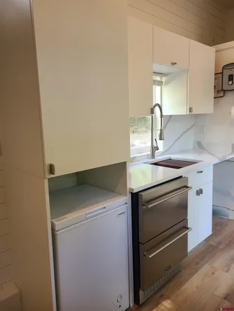 a kitchen with a stove and a sink
