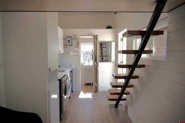 a view of entryway with stairs and wooden floor
