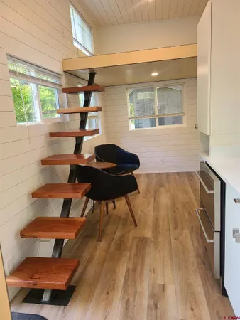 a room with wooden floor and a window