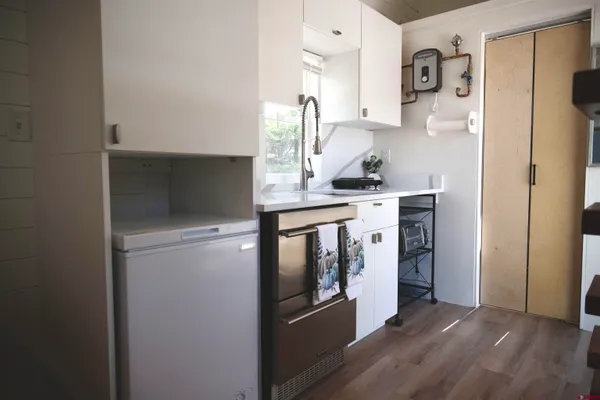 a kitchen with stainless steel appliances a stove and a refrigerator