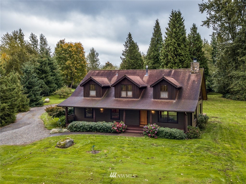 6570 North Star Road Ferndale, WA 98248 - Photo 1 of 39 a view of a house with a big yard plants and large trees