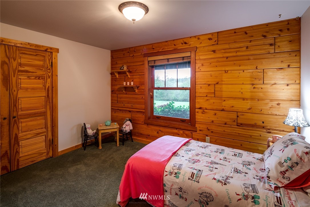 6570 North Star Road Ferndale, WA 98248 - Photo 22 of 39 a bedroom with a bed and furniture