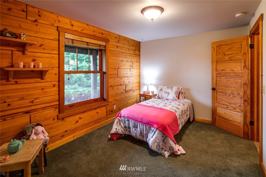 6570 North Star Road Ferndale, WA 98248 - Photo 23 of 39 a bedroom with a bed and a window