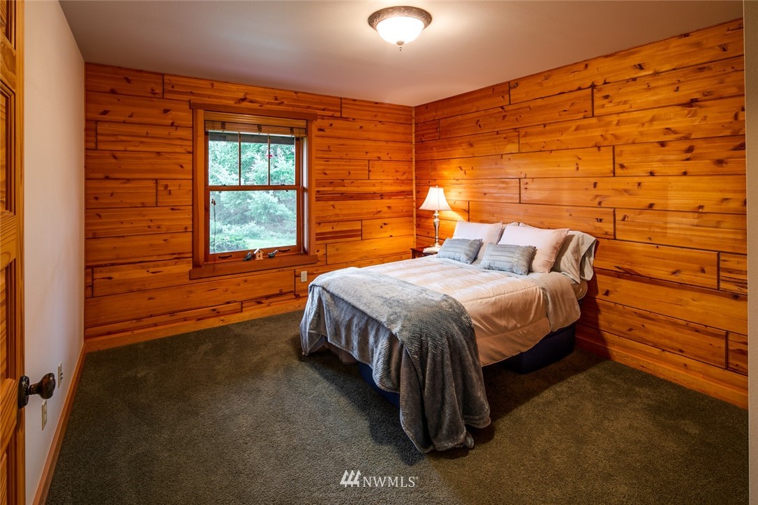 6570 North Star Road Ferndale, WA 98248 - Photo 24 of 39 a bedroom with a bed and a window