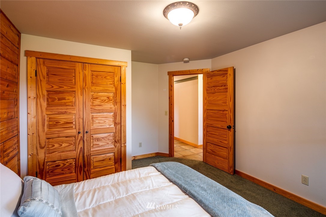6570 North Star Road Ferndale, WA 98248 - Photo 25 of 39 wooden floor and closet in a room