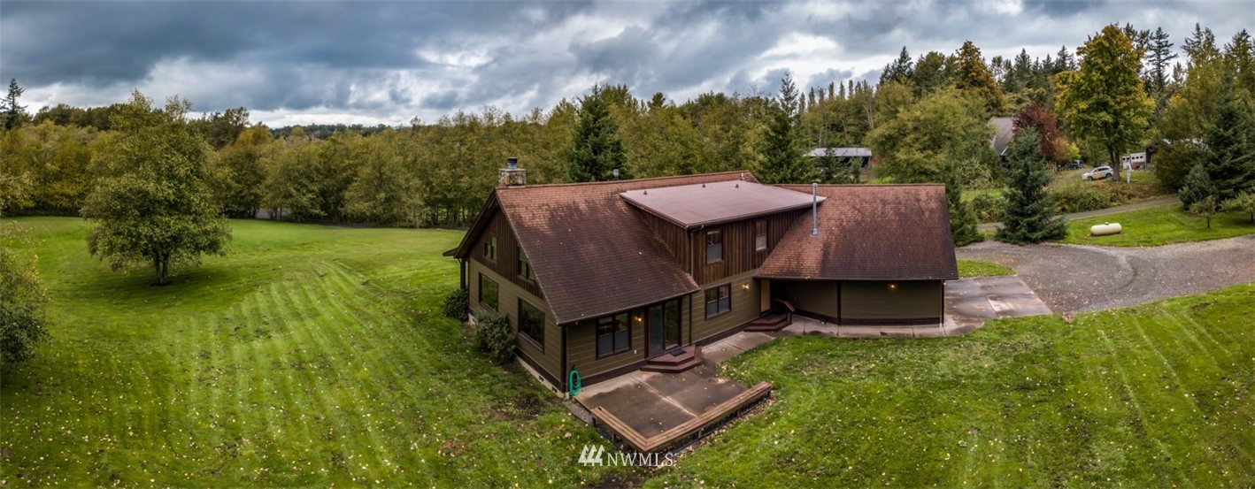 6570 North Star Road Ferndale, WA 98248 - Photo 33 of 39 an aerial view of a house with yard and mountain view
