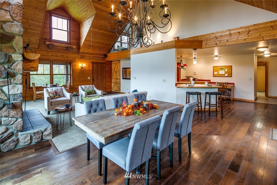 6570 North Star Road Ferndale, WA 98248 - Photo 7 of 39 a view of a dining room with furniture window and wooden floor