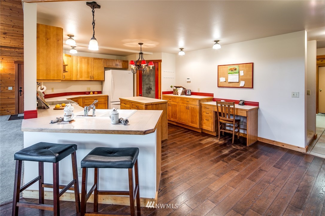 6570 North Star Road Ferndale, WA 98248 - Photo 9 of 39 a view of a dining room with furniture and wooden floor