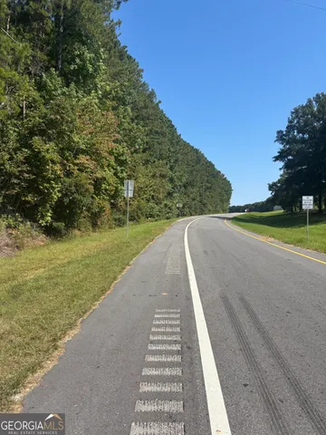 a view of a field with an trees