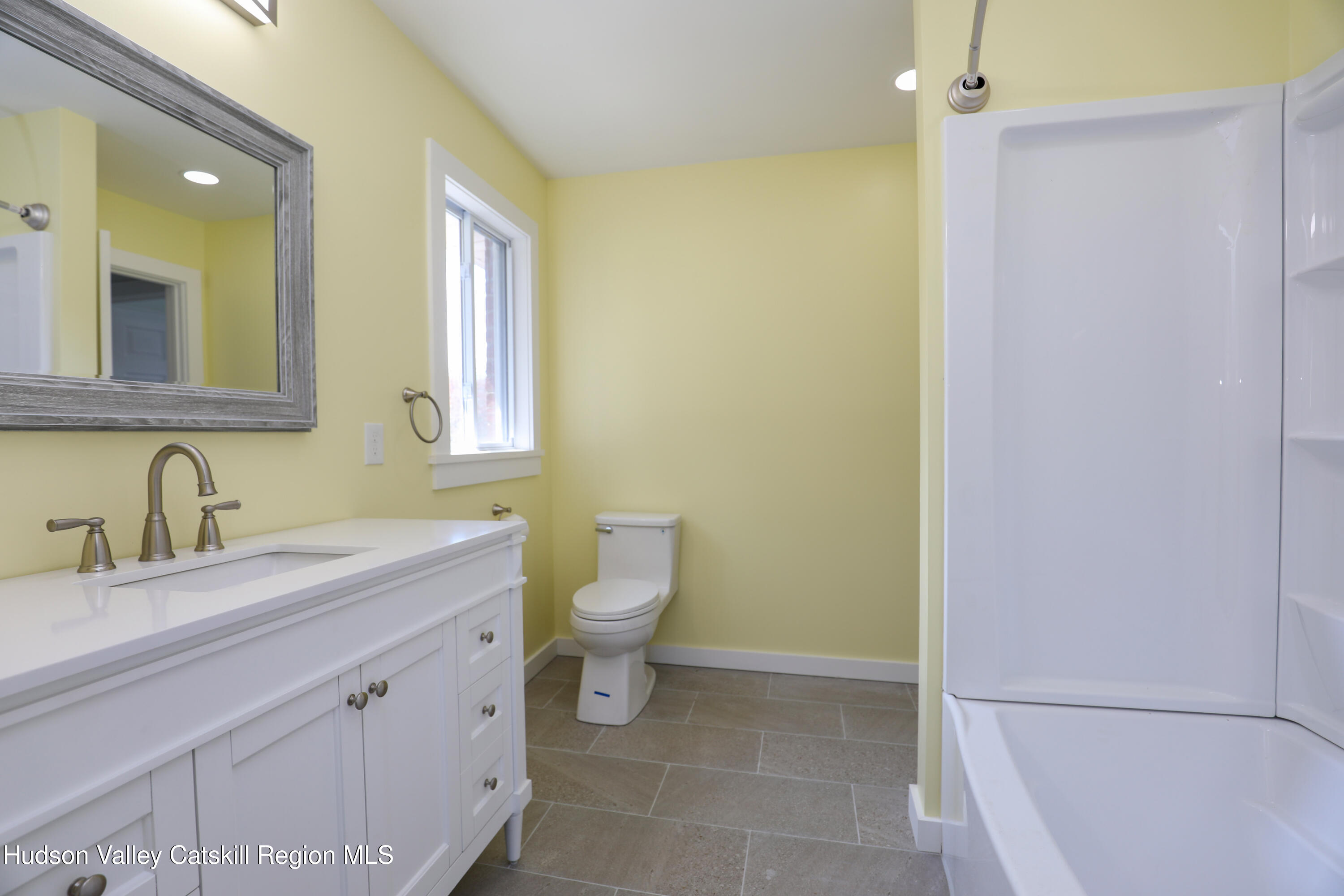 111 Zandhoek Road Hurley, NY 12443 - Photo 15 of 33 a bathroom with a granite countertop sink toilet and a mirror