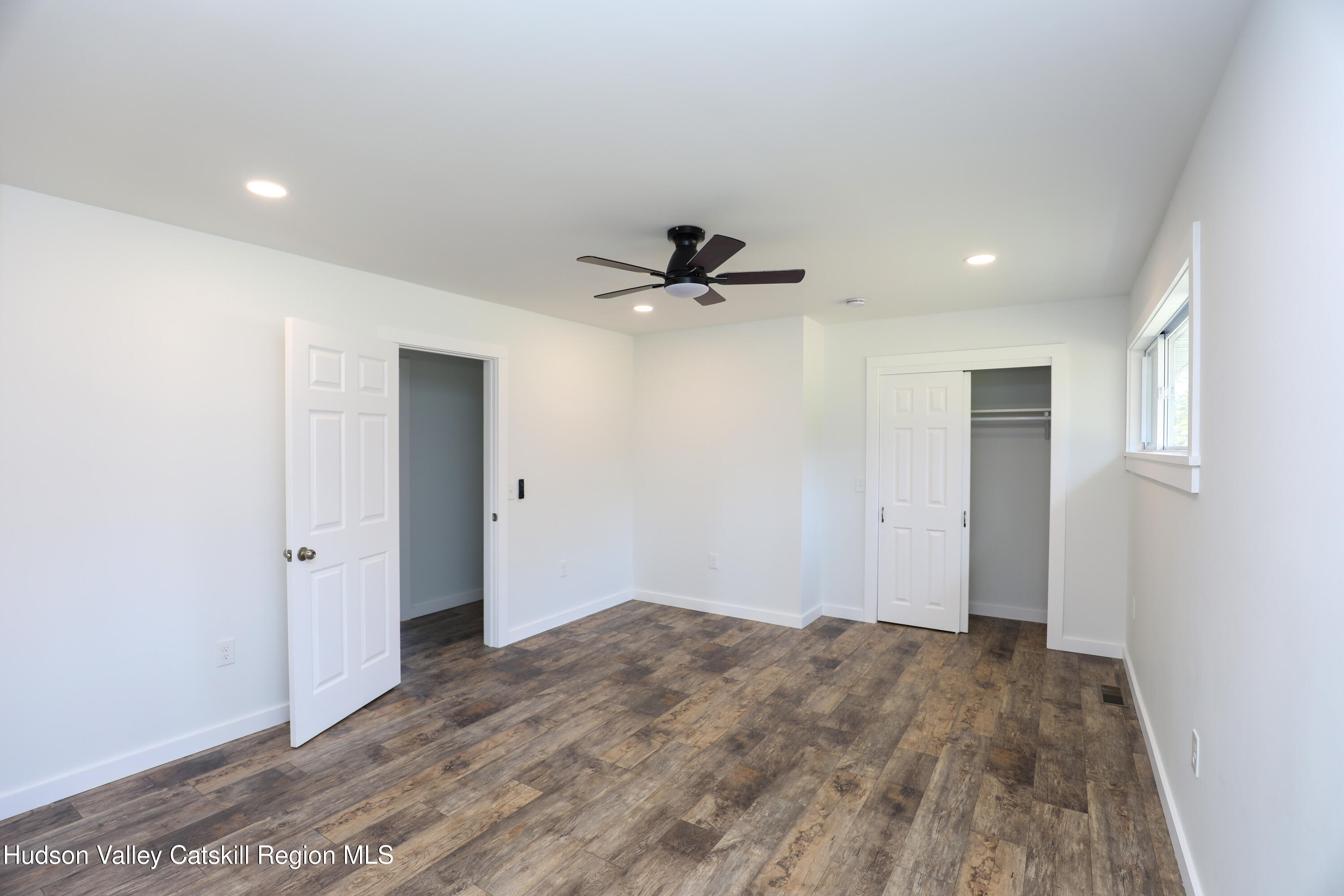 111 Zandhoek Road Hurley, NY 12443 - Photo 17 of 33 a view of empty room with wooden floor and ceiling fan