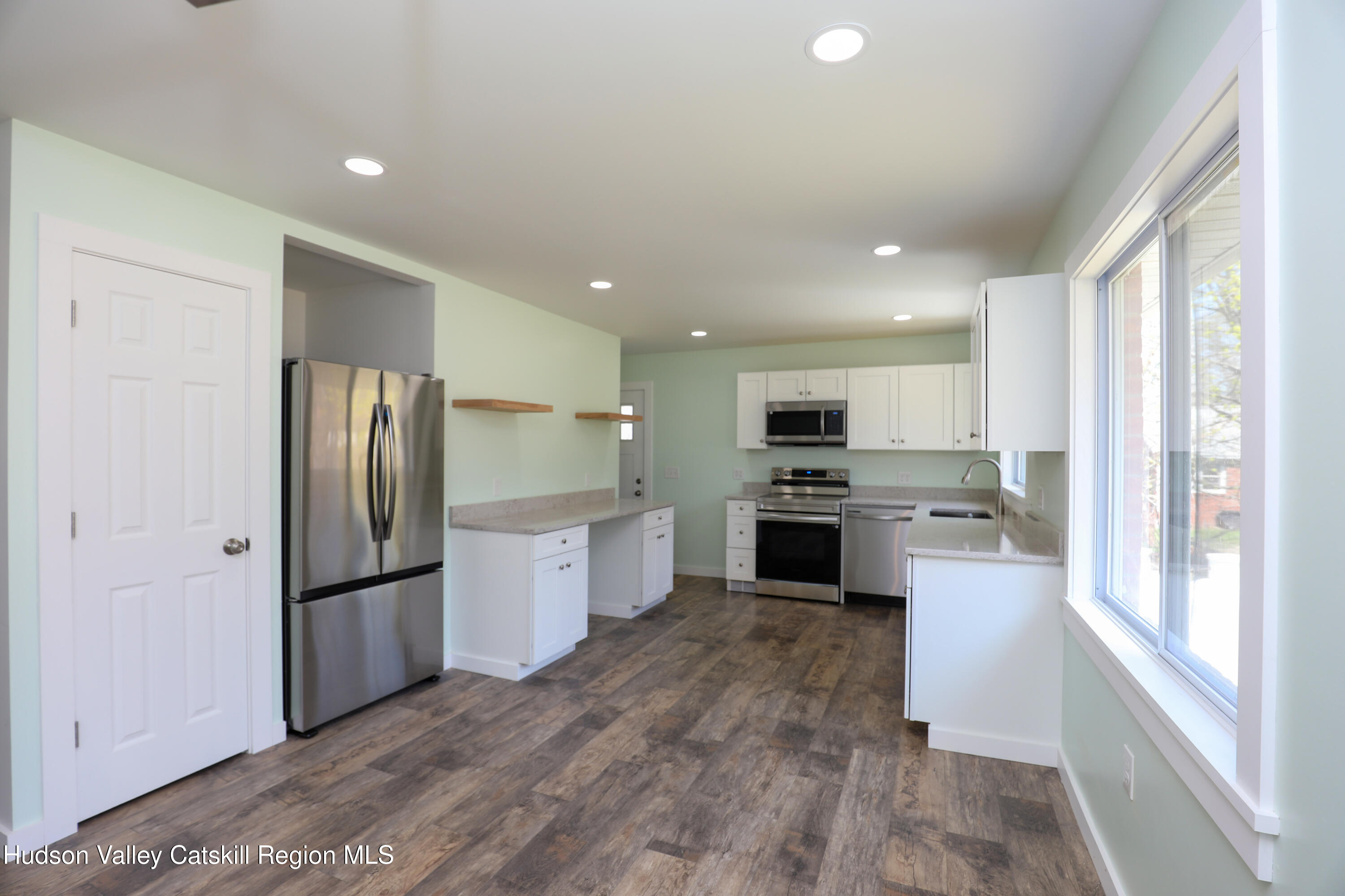 111 Zandhoek Road Hurley, NY 12443 - Photo 20 of 33 a kitchen with a refrigerator and a stove top oven