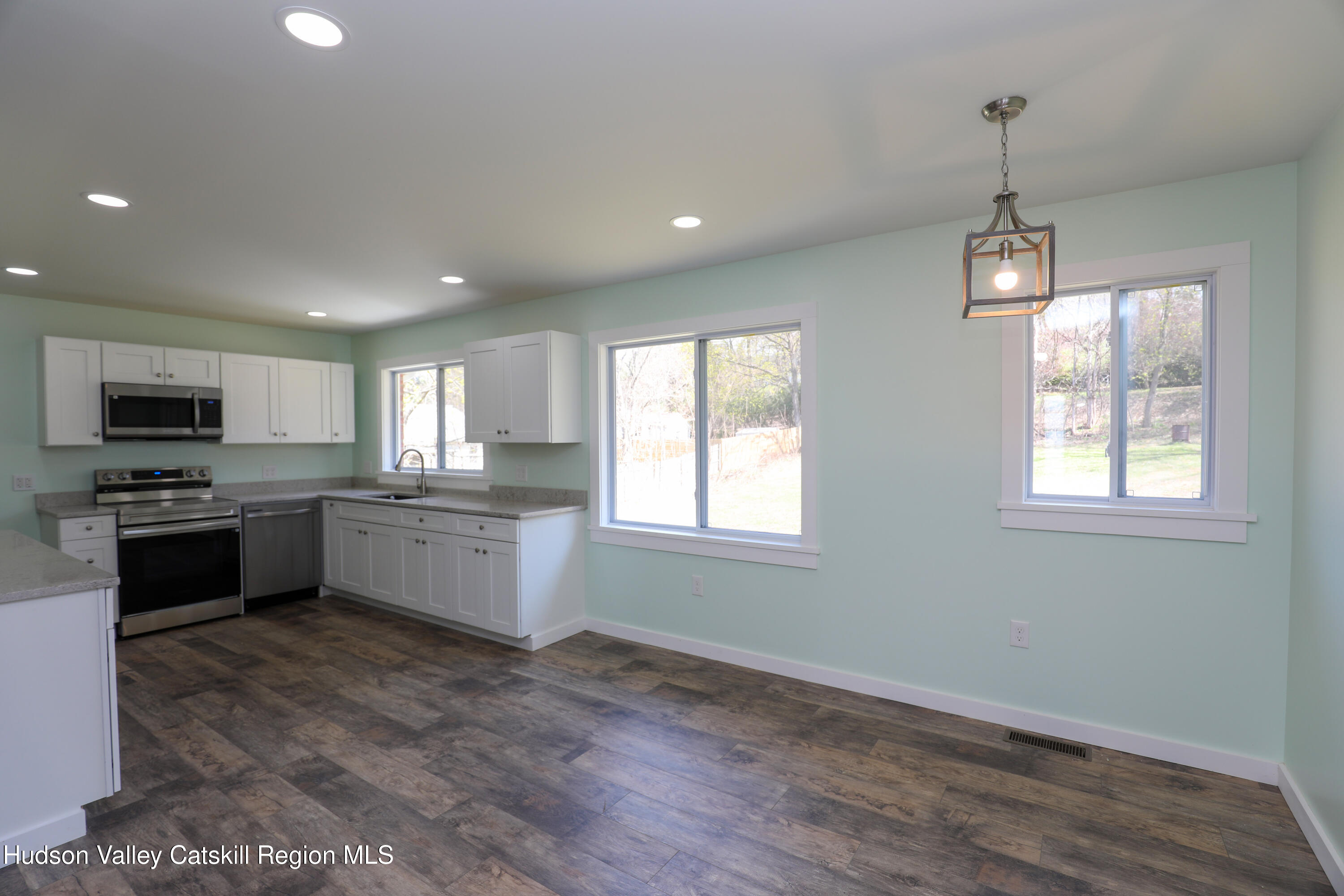111 Zandhoek Road Hurley, NY 12443 - Photo 22 of 33 a kitchen that has a lot of cabinets and stainless steel appliances
