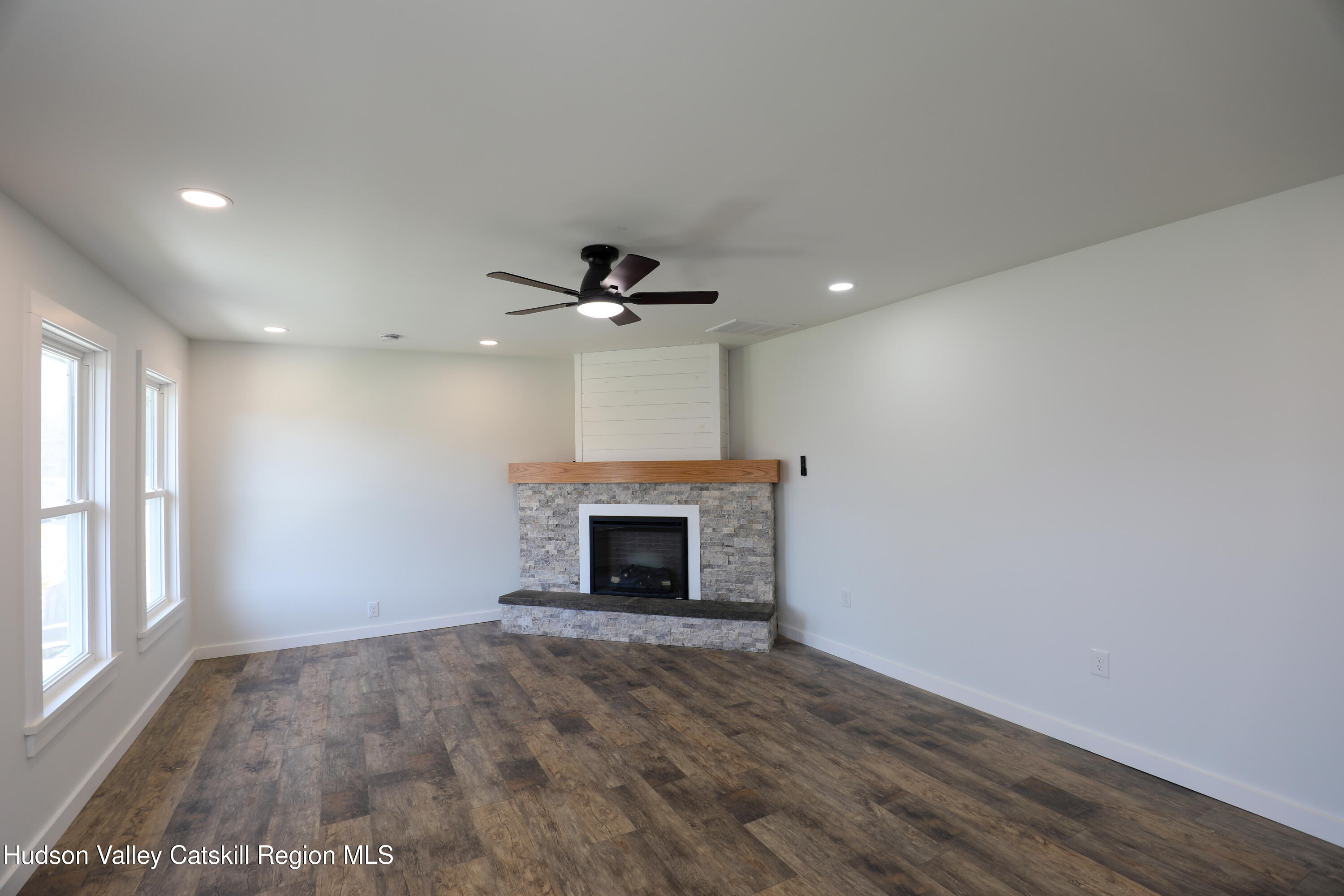 111 Zandhoek Road Hurley, NY 12443 - Photo 7 of 33 a view of an empty room with a fireplace and a window