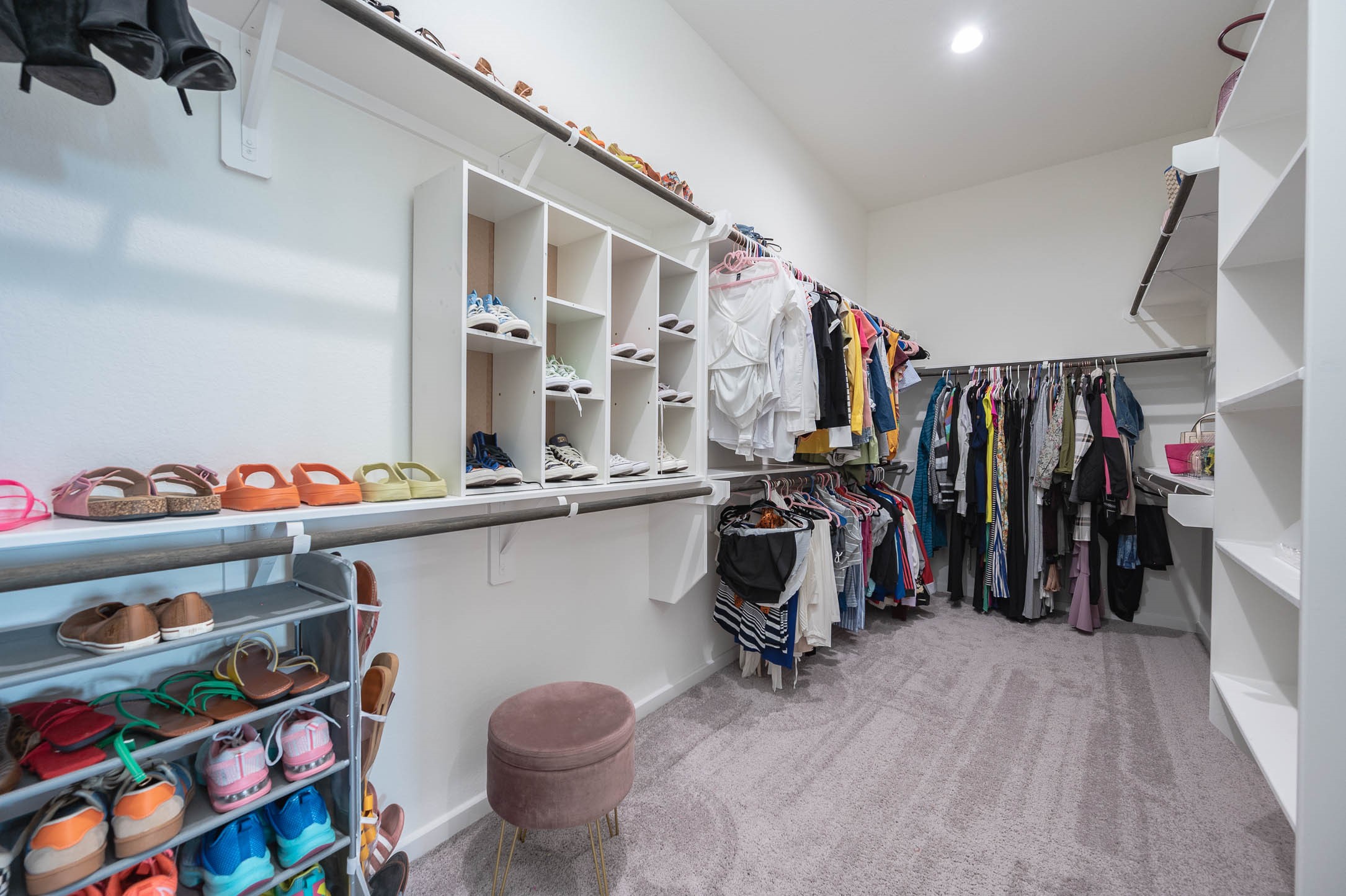 10926 Wander Way Beasley, TX 77417 - Photo 13 of 38 a view of walk in closet with clothes and shoes