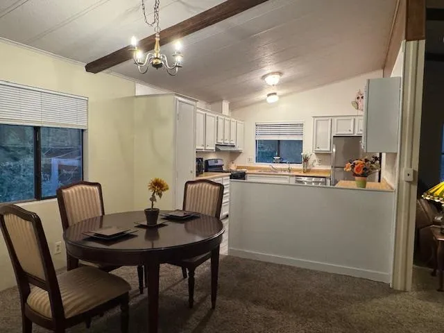 a view of a dining room with furniture
