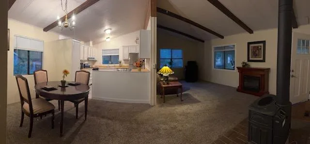 a view of a livingroom with furniture and a fireplace