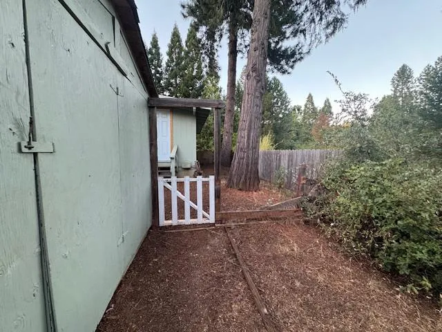 a view of a backyard with a patio and backyard