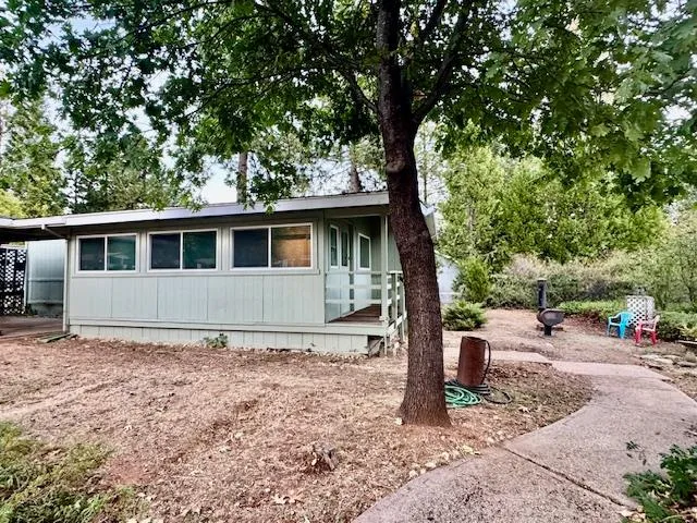 a house with trees in the background