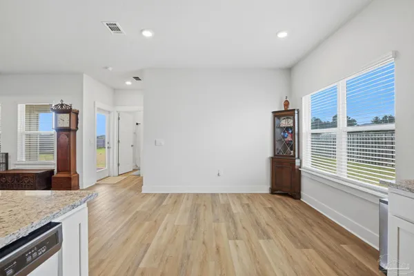 a view of a kitchen with a sink and a window