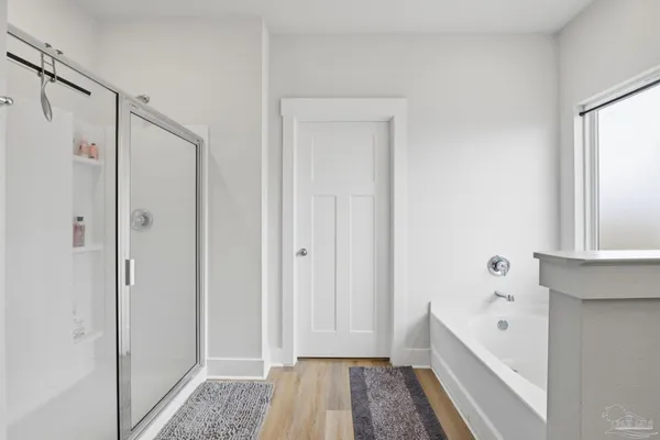 a bathroom with a bathtub and a shower