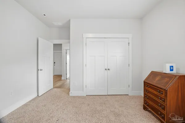 a room with a dresser and a cabinet