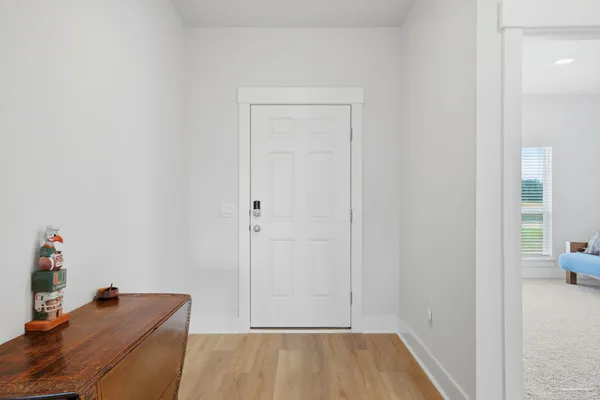 a view of room with baby crib and closet