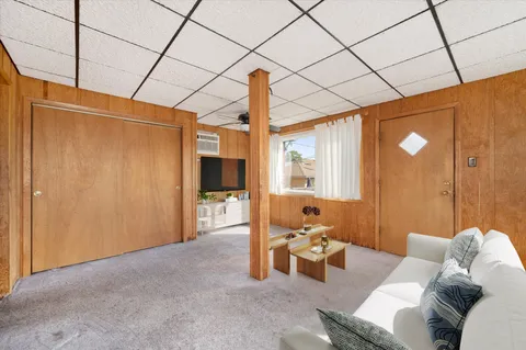 a bed room with furniture and a window