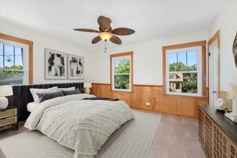 a bedroom with a large bed and a window