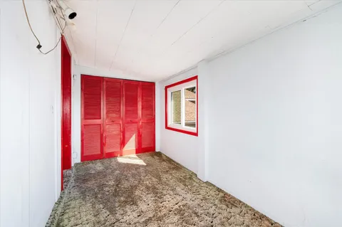 a picture of a bench in front of a wall