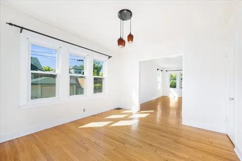 a front view of a house with wooden floor