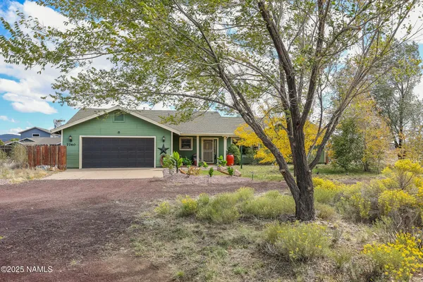 a house with trees in front of it