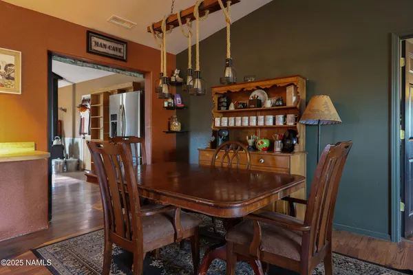 a dining room with furniture and window