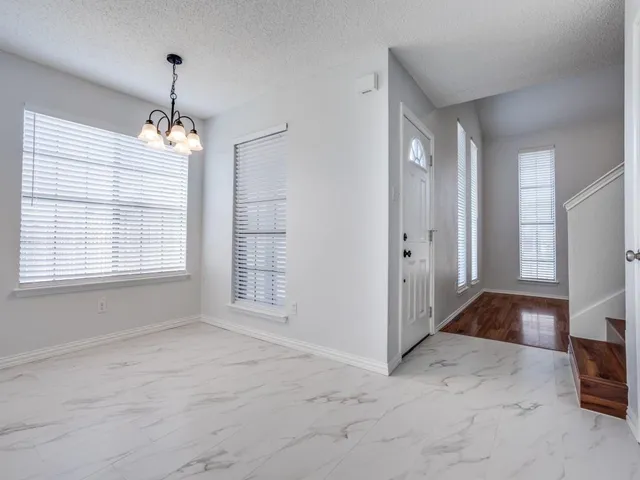 a view of livingroom with hardwood floor and hallway