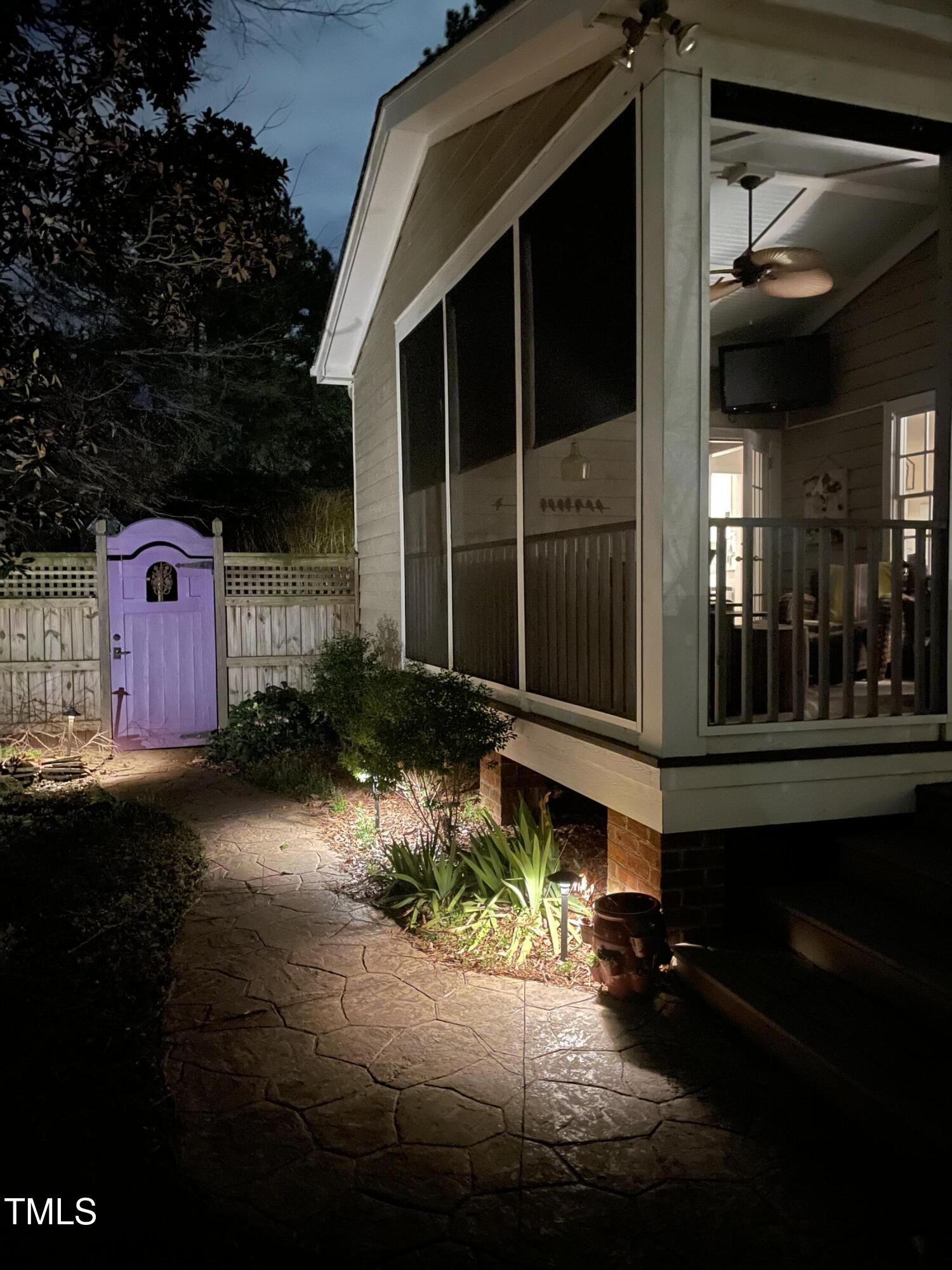 1712 Briarforest Place Raleigh, NC 27615 - Photo 51 of 55 View of backyard at night with the professionally installed landscape lighting.