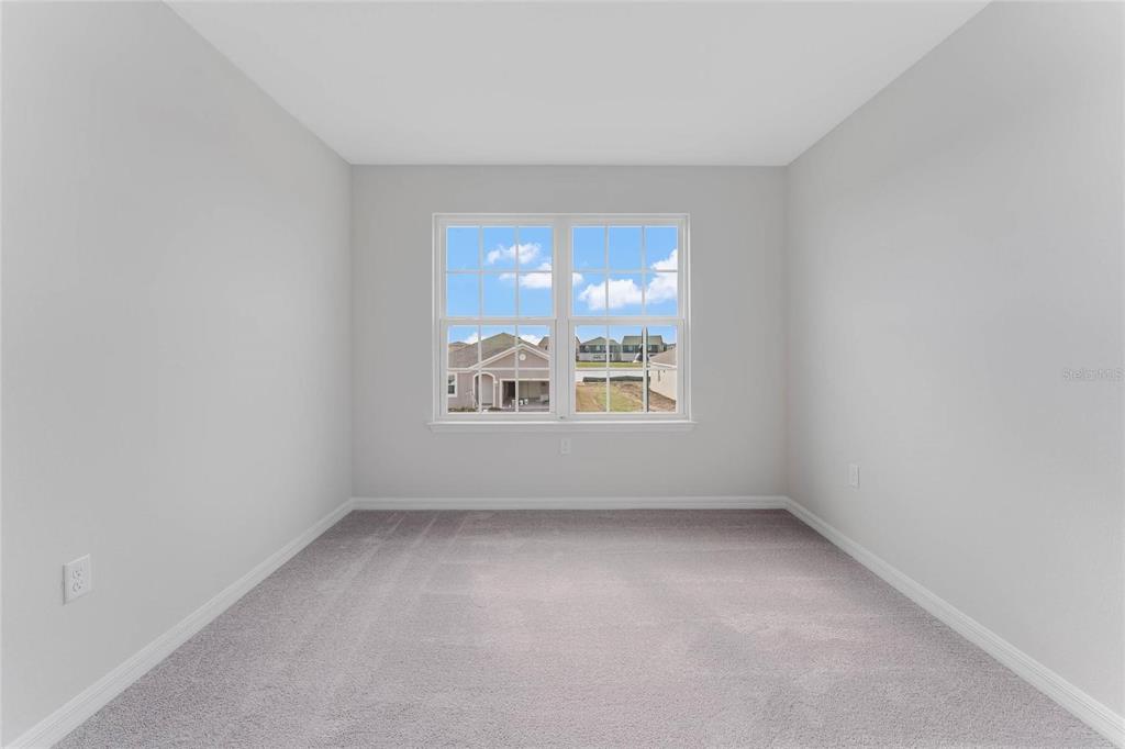 9592 Starling Loop Leesburg, FL 34788 - Photo 23 of 34 an empty room with a window