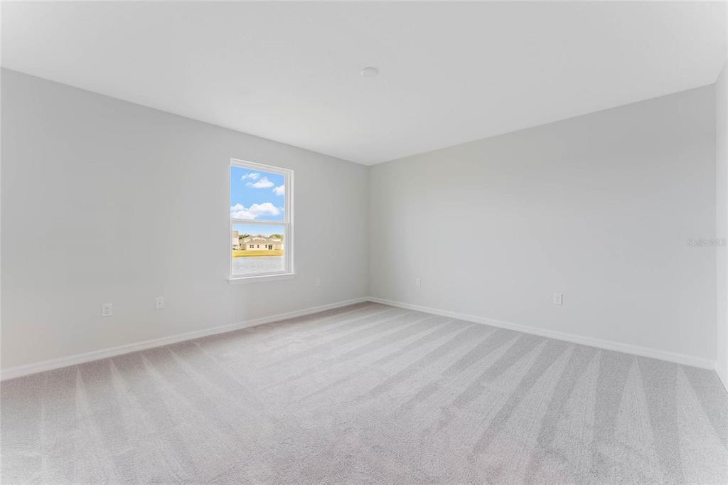 9592 Starling Loop Leesburg, FL 34788 - Photo 25 of 34 an empty room with a window
