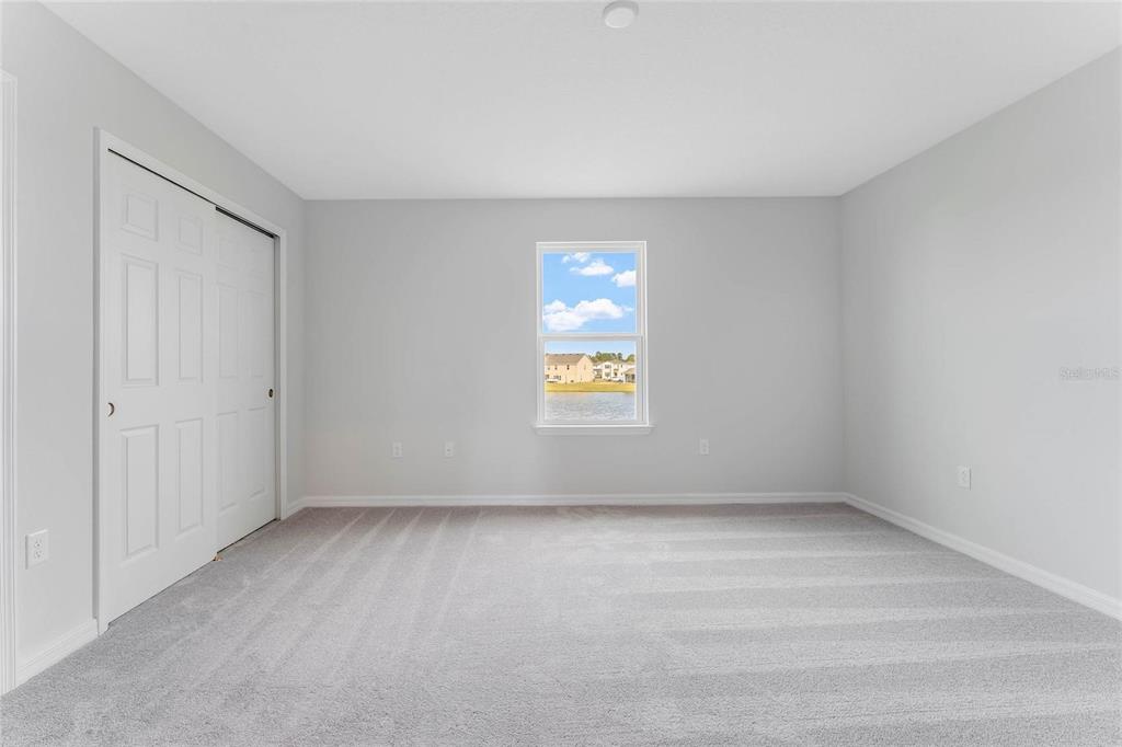 9592 Starling Loop Leesburg, FL 34788 - Photo 26 of 34 a view of an empty room with a window