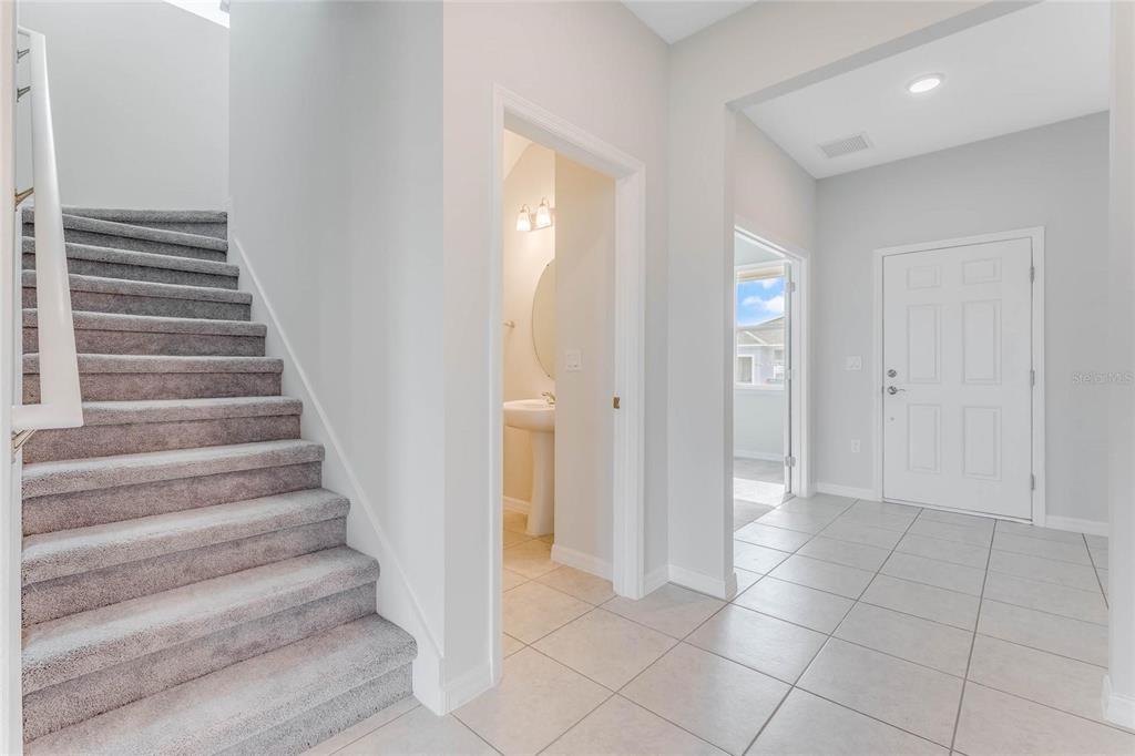 9592 Starling Loop Leesburg, FL 34788 - Photo 10 of 34 a view of an entryway with staircase
