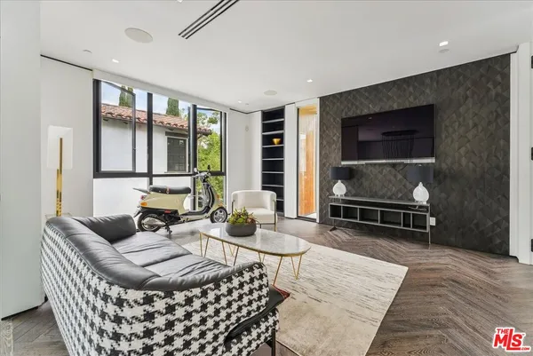 a living room with furniture and a rug